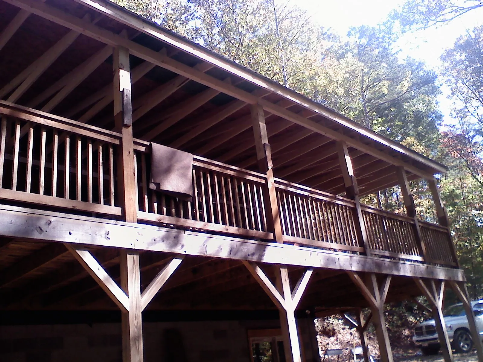 Timber framing under a new elevated porch and deck — Roof Leak Repair in High Point by Roofing Brothers